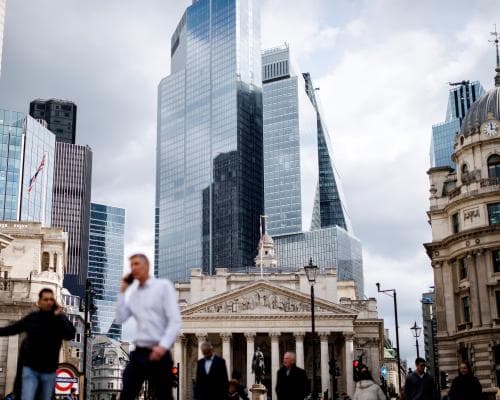 FTSE 100 hits 10,000 point milestone for first time, after best year of gains since 2009 – as it happened